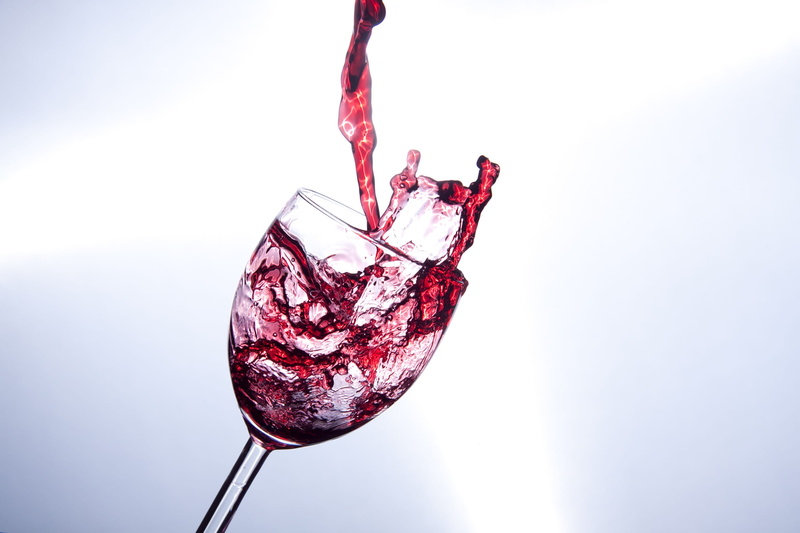 indoors, no people, aggression, studio shot, copy space, red wine, motion, wine, water, blood, food, glass, liquid, red, spilling, white background, pouring