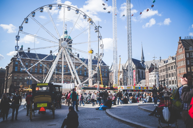 group, men, group of people, built structure, amusement park, street, festival, fun, steel structures, city life, brown, building exterior, sitting, real people