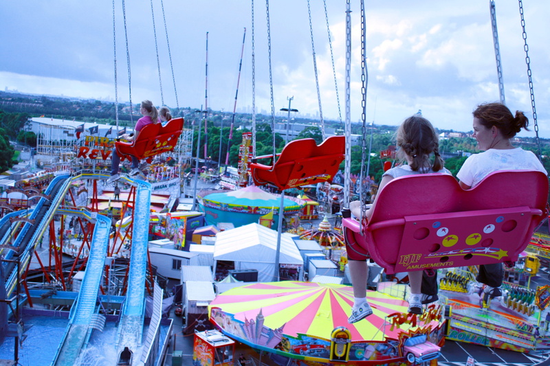 excitement, two people, carnival, holiday, lifestyles, sitting, fun, ride, fairground, adult, rear view, circus, women, cloud - sky, nature, sailboat, funfair