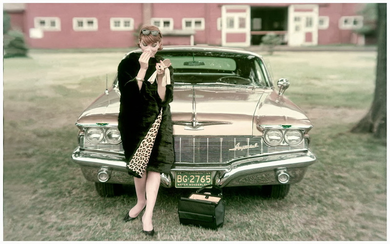 building exterior, standing, one person, mode of transportation, motor vehicle, built structure, outdoors, hairstyle, car, women with cars, clothing, vehicle