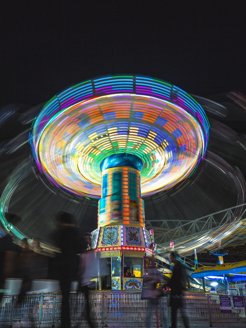 swing, fairground, illuminated, lifestyles, carousel, spinning, amusement, joy, night, photography, happy, real people, amusement park, multicolored, walking