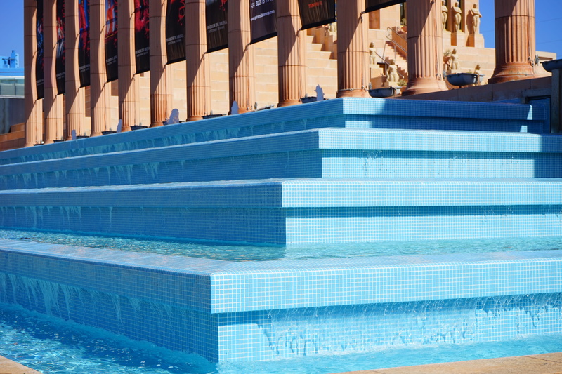 day, water, stairs, outdoors, turquoise colored, columnar, reflection, sunlight, swimming pool, gradually, no people, built structure, in a row, 5K, building exterior