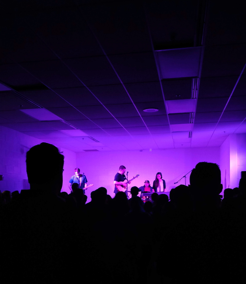 clubbing, purple, dark, large group of people, ceiling, person, performance, group of people, nightlife, stage, event, lighting equipment, crowd, fun, enjoyment