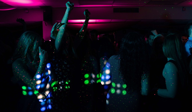 dancing, blur, human arm, nightlife, leisure, real people, band, audience, illuminated, men, dark, large group of people, night, emotion, event, arts culture and entertainment