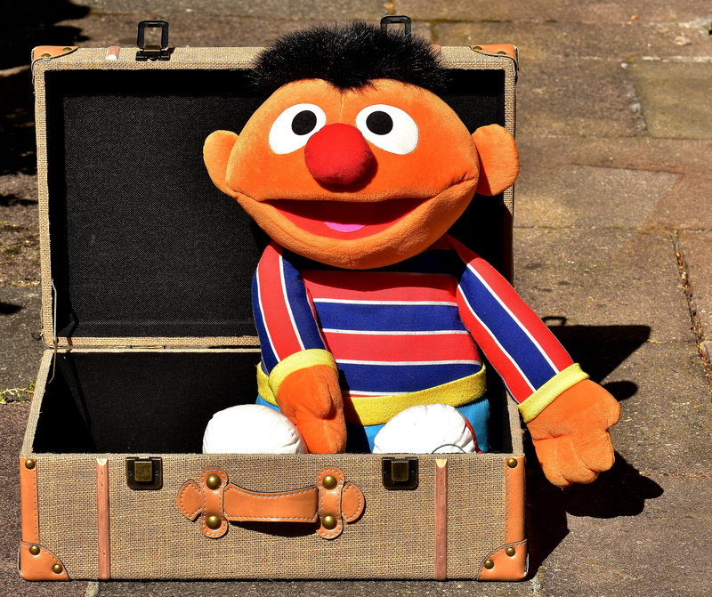 close-up, briefcase, day, built structure, outdoors, art and craft, human representation, toys, stuffed toy, still life, play, sesame street, teddy bear