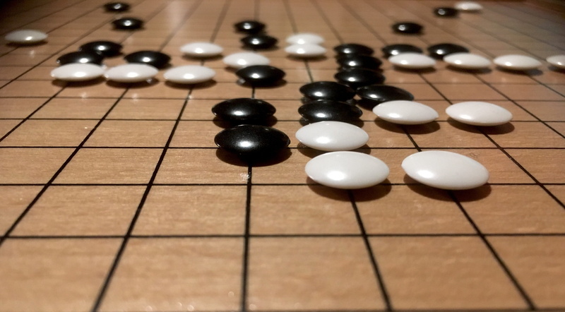 indoors, arts culture and entertainment, games, focus on foreground, wood - material, board game, white color, close-up, leisure games, board games, go