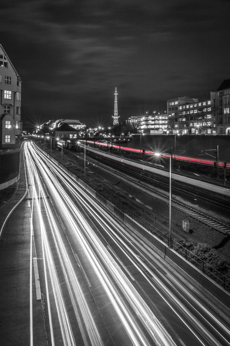 city, night, grayscale, mode of Transport, cloud - sky, motion, sky, transportation, big city, high angle view, radio tower, seemed, urban Scene, no people