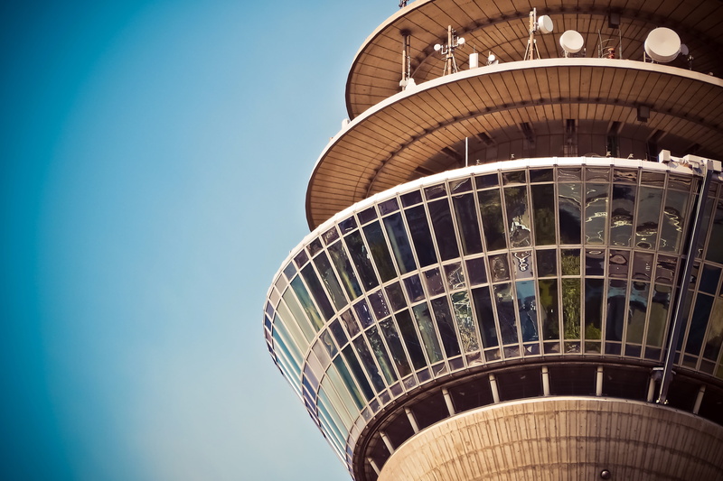 no people, arts culture and entertainment, lighting, radio tower, city, sunlight, düsseldorf, low angle view, modern, glass, landmark, architecture, outdoors