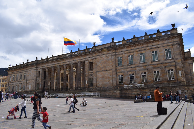 building exterior, tourism, patriotism, bogotá, colombia, government, day, built structure, sky, architecture, real people, women, flag, 4K, capital, lifestyles