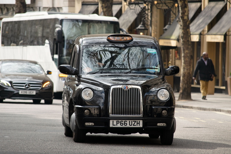 car, built structure, street, stationary, taxi, black cab, incidental people, motor vehicle, retro styled, mode of transportation, england, black, road