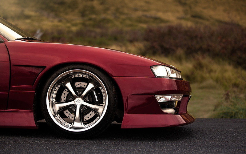 land vehicle, red cars, sports car, luxury, road, transportation, Nissan, convertible, 1080P, wheel, driving, city, chrome, gray, tire, silver colored
