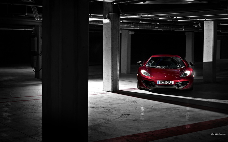 night, black, motor vehicle, built structure, garage, public transportation, transportation, illuminated, parking garage, flooring, no people, red, indoors