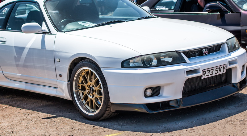 mode of transportation, nissan, street, land vehicle, r33, tuned, motor vehicle, city, vintage, motor, automotive, show, luxury, day, tuning, no people