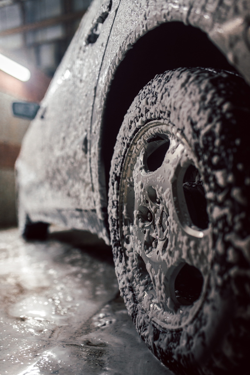 no people, grey, rubber, metal, tire, mode of transportation, stationary, wheel, bent, car, benz, indoors, motor vehicle, selective focus, focus on foreground