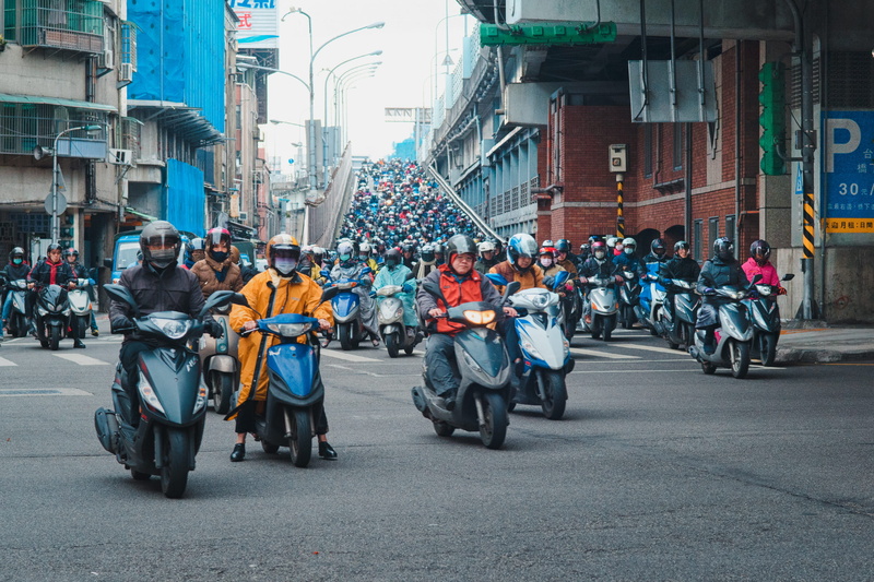 outdoors, crowd, city street, photo, women, built structure, scooters, scooter, motor, riding, rally, motorcycle, 2K, people, uniform, transportation