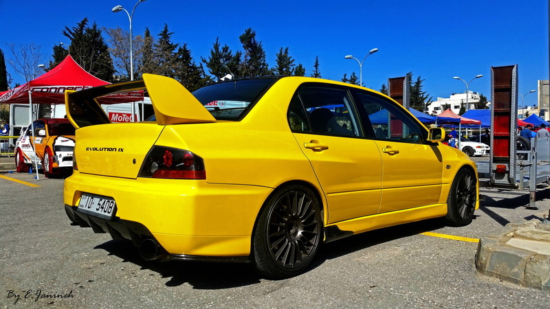 tree, Mitsubishi, yellow cars, building exterior, city, road, built structure, mode of transportation, outdoors, motor vehicle, nature, transportation