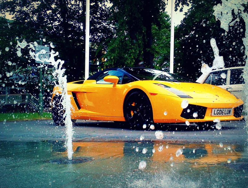outdoors, Lamborghini, school bus, Lamborghini Gallardo, city, car, yellow, transportation, wet, motion, waterfront, no people, nature, motor vehicle, day