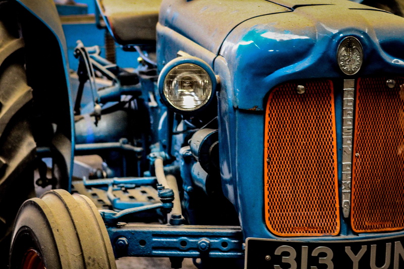 close-up, transportation, vehicle part, land vehicle, grill, day, theme numbers, motorsport, focus on foreground, ford, car, orange, tyres, metal, outdoors