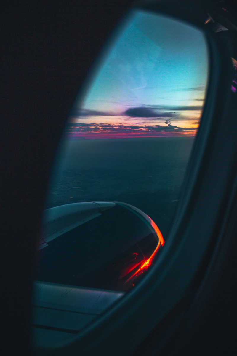 glass - material, light, car seat, airplane, flare, flight, window, car mirror, journey, driving, car, land vehicle, gauge, vehicle, air vehicle, spaceship