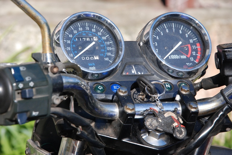 mode of transportation, motorcycle, no people, speed, focus on foreground, number, instrument of measurement, metal, a speedometer, automotive, speedometer