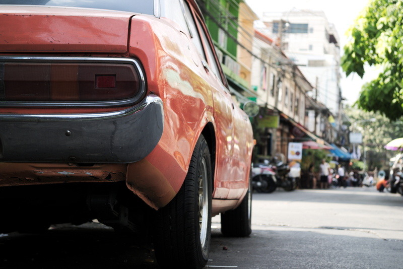 wheel, youngtimer, alley in bangkok, built structure, stationary, 5K, city life, motor vehicle, day, focus on foreground, car, mode of transportation