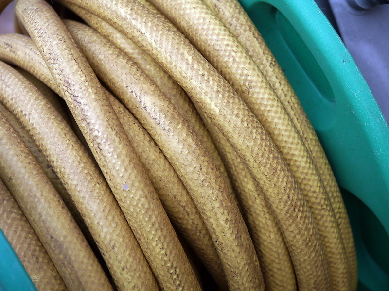 no people, still life, studio shot, indoors, stack, hose, roll, high angle view, medium group of objects, backgrounds, outdoors, choice, freshness, food and drink