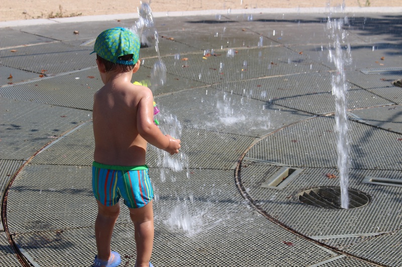 standing, rear view, garden hose, spraying, real people, males, childhood, innocence, motion, men, full length, shirtless, three quarter length, wet, shorts