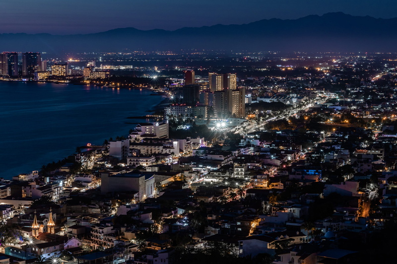 condo, aerial view, sky, scenery, architecture, housing, office building exterior, road, urban, illuminated, cityscape, puerto vallarta, sunset, mountain range
