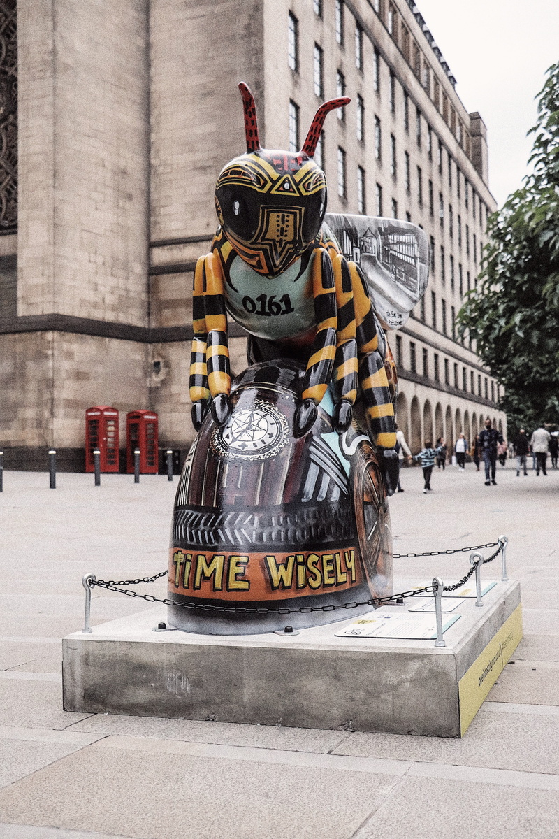 explore, protection, built structure, communication, sculpture, street, incidental people, manchester, text, manchester bee, western script, spend time wisely