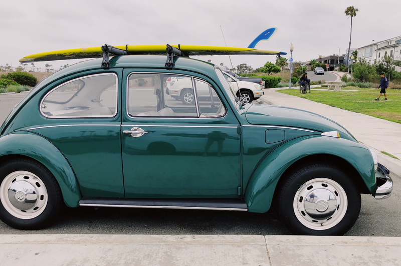 person, yellow, retro styled, lot, vintage car, empty, united states, nature, roof rack, motor vehicle, city, sky, day, park, car, carrying, beatle, automobile