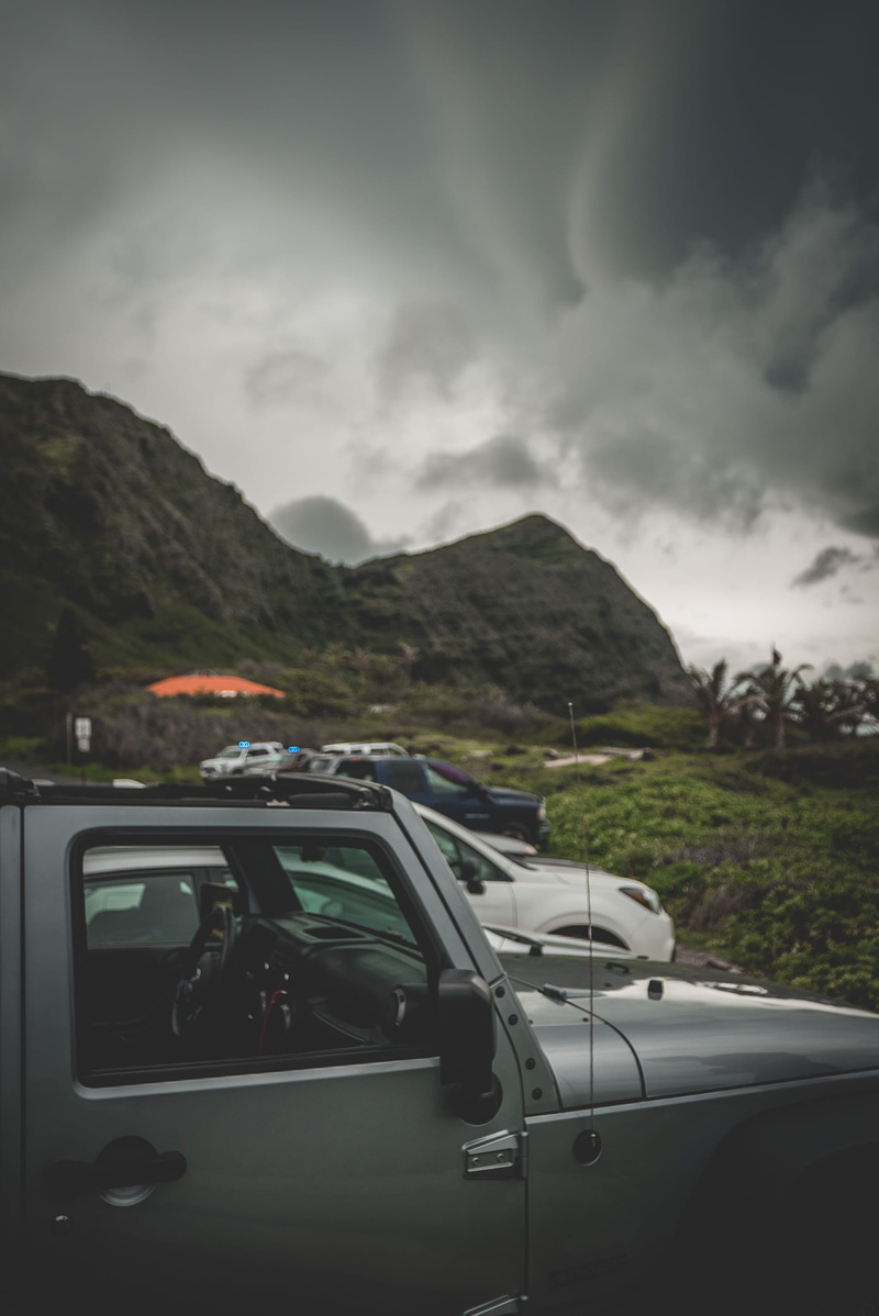 non-urban scene, automobile, mountain range, road, day, vehicle, tropical, mode of transportation, cloud - sky, road trip, tree, oahu, overcast, explore