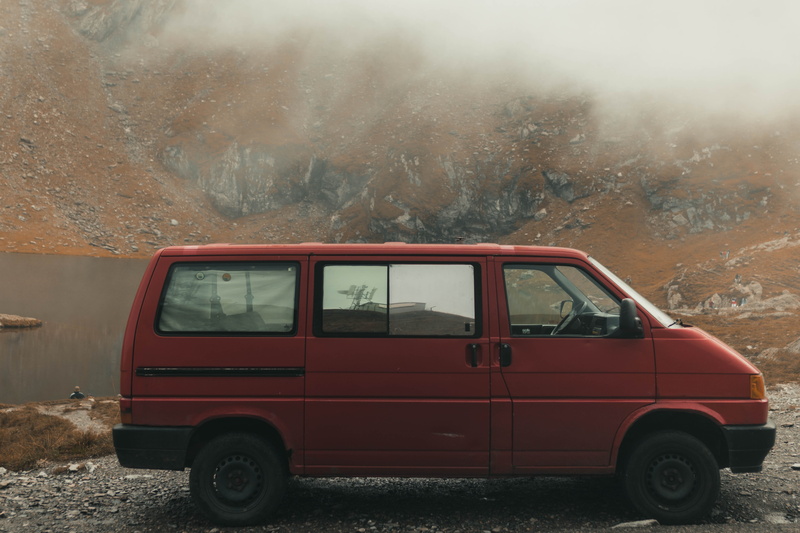 street, wheel, mode of transportation, automobile, outdoors, spoke, van, red, ambulance, land, tire, vise, road, car wheel, day, fog, machine, alloy wheel
