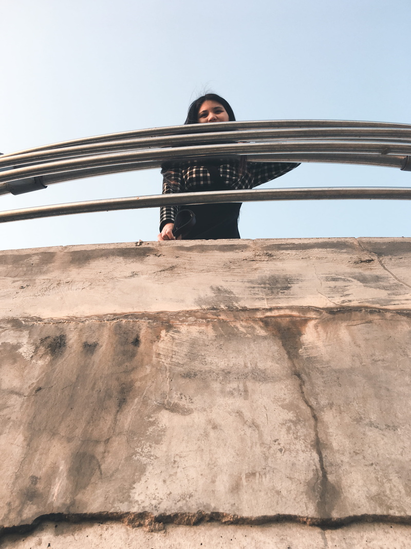 roof rack, day, sky, desert, standing, leisure activity, full length, looking at camera, transportation, banister, lifestyles, slope, nature, front view
