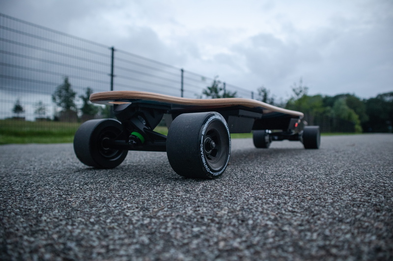 street, day, nature, sports car, concrete, wheel, cloud - sky, rotterdam, surface level, skateboard, transportation, mode of transportation, architecture