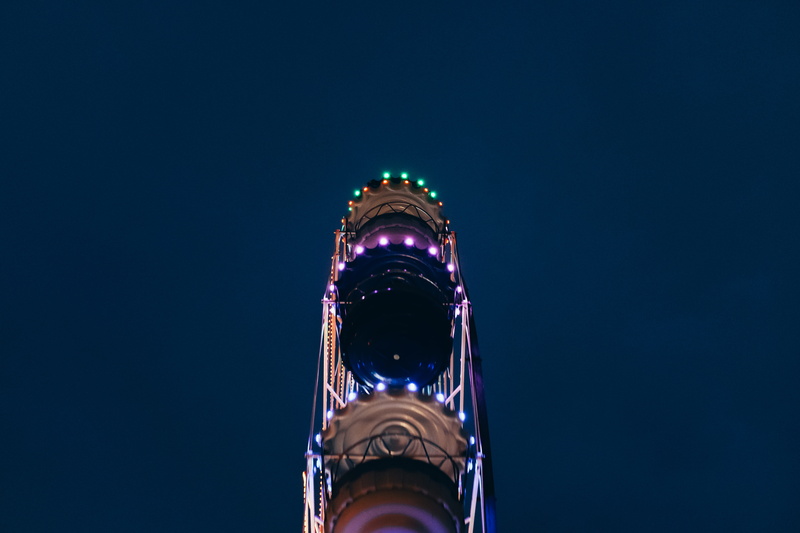 ferris whell, low angle view, wheel, city, illuminated, travel, blue background, 5K, night, building exterior, minimal, nature, ferris, no people, tourism