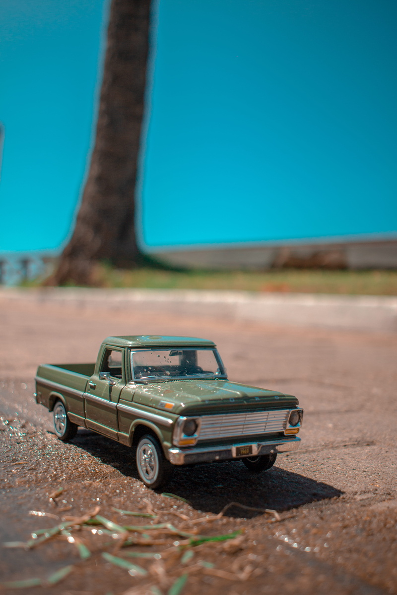 tarmac, asphalt, alagoas beach, copy space, person, toy, offroad, transportation, toy car, blue, land vehicle, 5K, clear sky, gravel, machine, human, mode of transportation