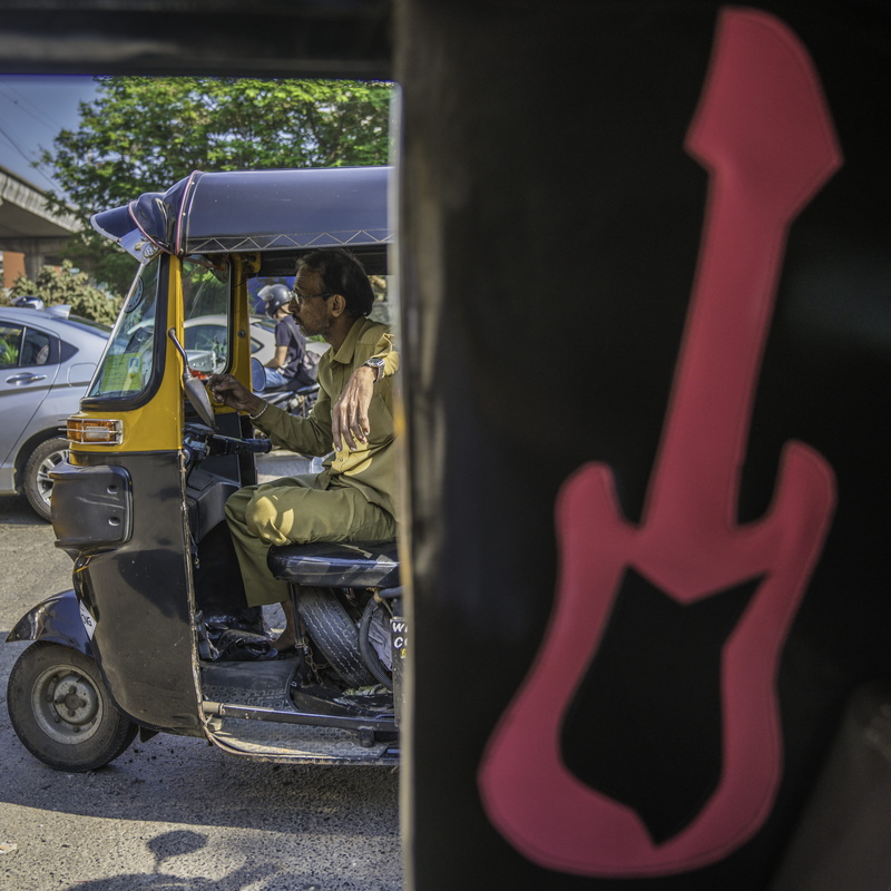 guitar, outdoors, person, real people, land vehicle, marol, car, jinrikisha, golf cart, transportation, kite, men, train, man, travel, moving van, vehicle