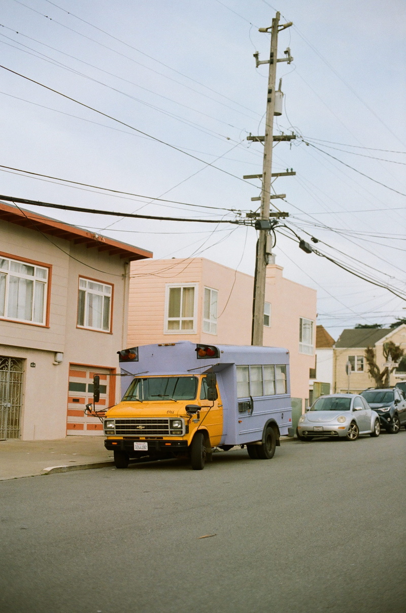 day, built structure, parked, car, moving van, house, transportation, truck, near, school bus, urban, technology, rv, motor vehicle, machine, no people