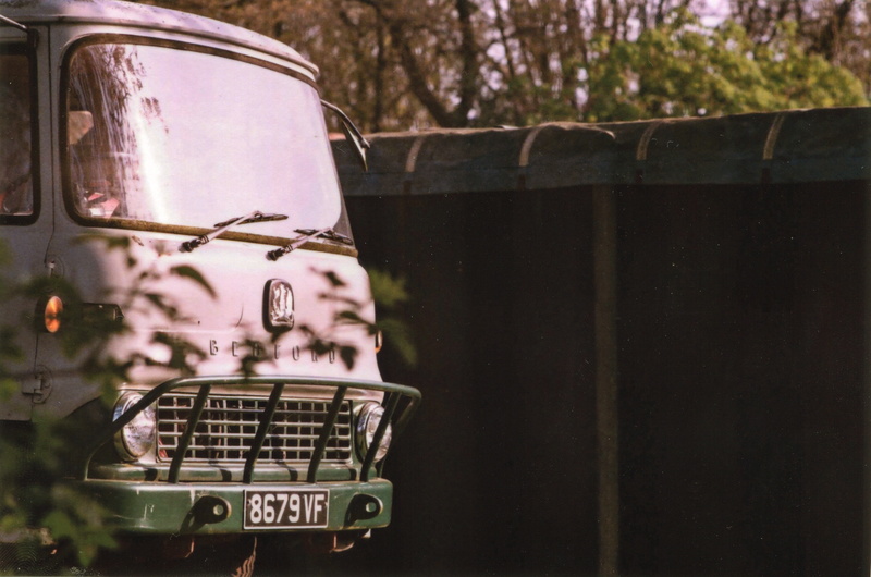 text, focus on foreground, travel, bonnet, wall, metal, van, fence, hood, tree, mousehold heath public carpark, vehicle, rust, western script, day, land vehicle