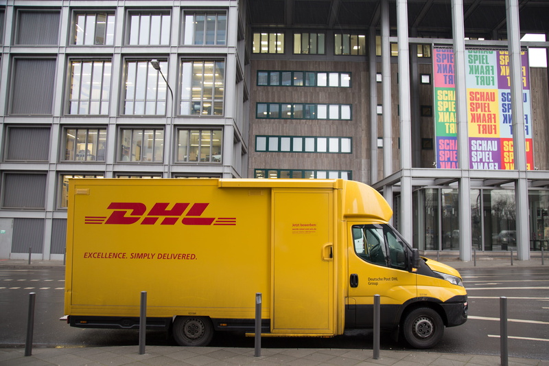 5K, motor vehicle, architecture, dhl, road, built structure, parked, street, yellow, car, transportation, communication, outdoors, no people, taxi, city