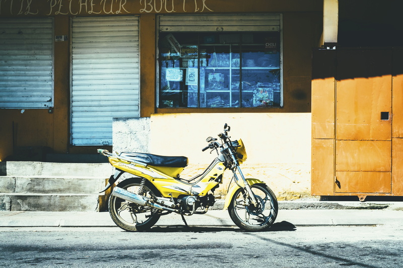 urban Scene, outdoors, no people, mode of transportation, entrance, building exterior, yellow, land vehicle, motorcycle, parking, bike, 4K, bicycle, shadow