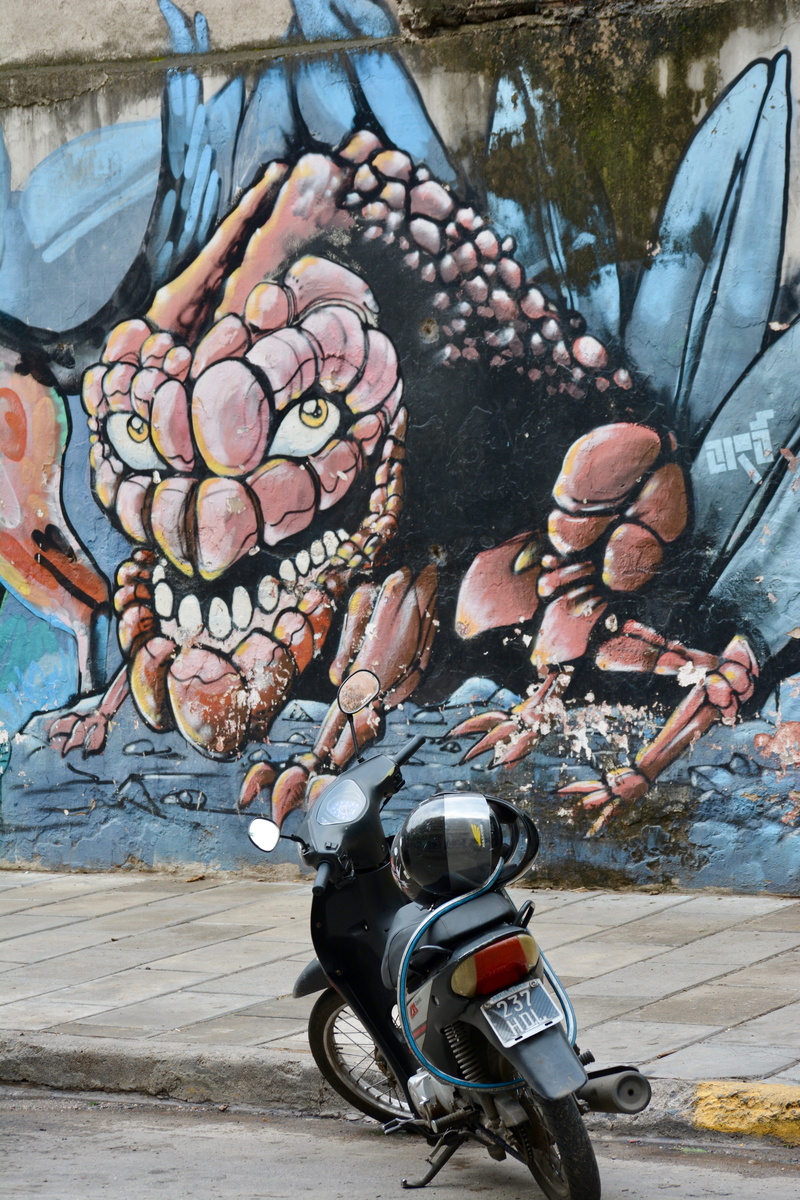 urban, pathway, lifestyles, art, land vehicle, mode of transportation, motor scooter, nature, one person, scooter, street art, real people, front, black
