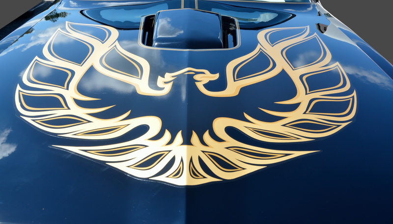 single object, automobile, gold, car, black color, decorative, gold colored, blue, artist, decoration, vehicle, close-up, striping, pinstripe, hood, vintage