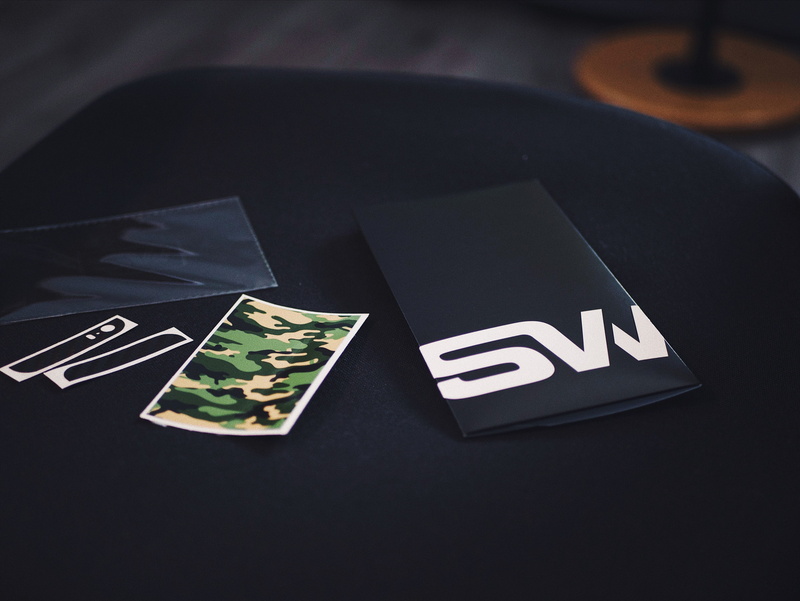 no people, black, table, studio shot, tech, surface, camouflage, indoors, communication, close-up, woodland, symbol, sticker, black background, black color