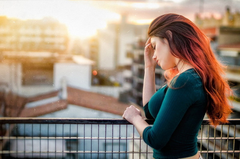 profile view, women, emotion, long hair, Delaia Gonzalez , depression - sadness, architecture, looking, city, focus on foreground, one person, contemplation