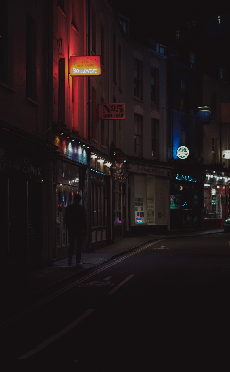 architecture, signage, building exterior, lighted, one person, logo, pub, shop, trademark, alleyway, alley, downtown, bar counter, built structure, road