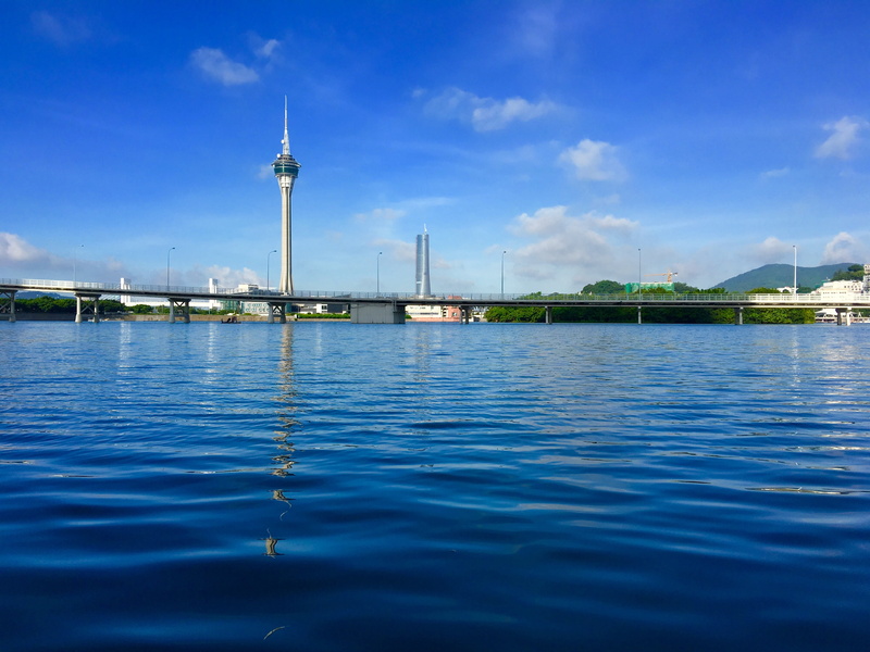 travel destinations, macau, sky, built structure, cloud - sky, sailboat, spire, tower telecom, travel, no people, water, river, tourism, day, tower, cityscape