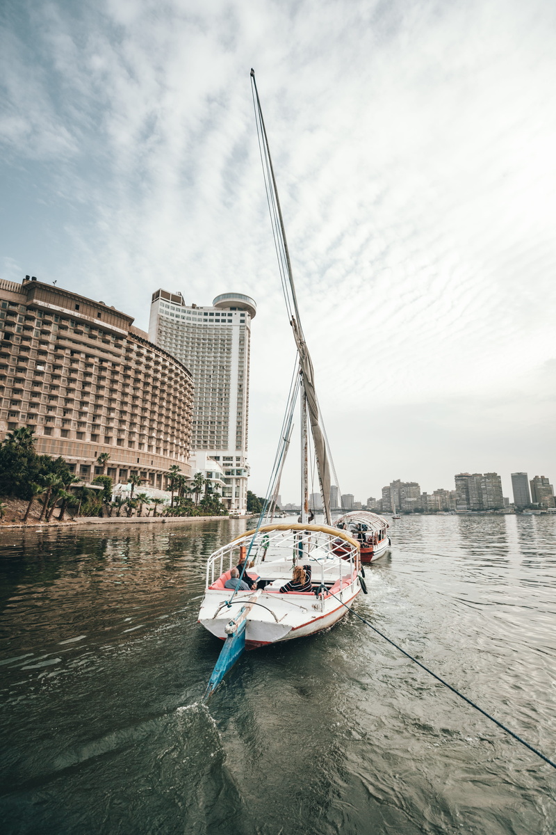 outdoors, cairo, building exterior, luxury, cloud - sky, river, watercraft, transportation, travel, egypt, pier, water, vehicle, nautical vessel, passenger craft