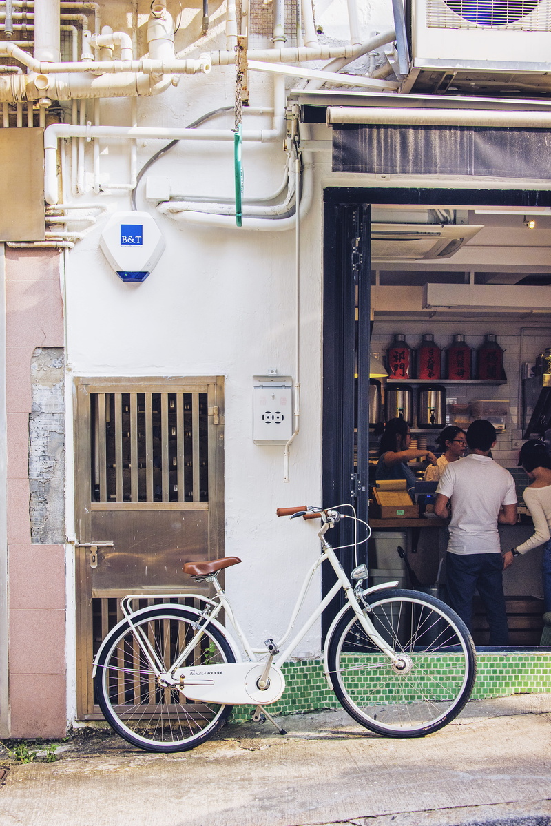 outdoors, architecture, transportation, building, men, machine, city, adult, bike, small business, shop, parked, tire, building exterior, vehicle, person