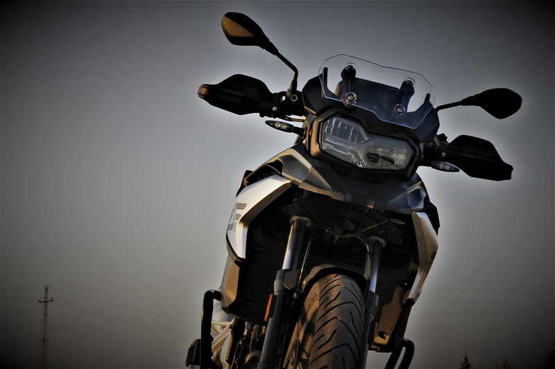 crash helmet, one person, day, gs, headwear, engine, riding, helmet, land vehicle, low angle view, sky, vignette, f750gs, nature, 5K, stationary, mode of transportation